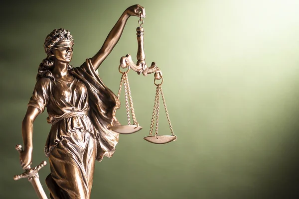 depositphotos_320456220-stock-photo-bronze-statue-of-justice-with